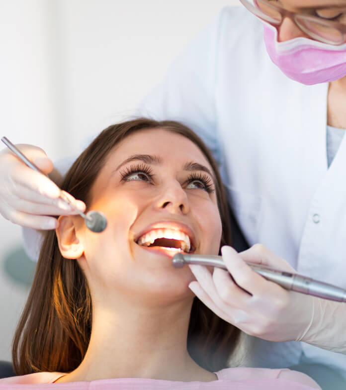 Woman being examined in dental chair